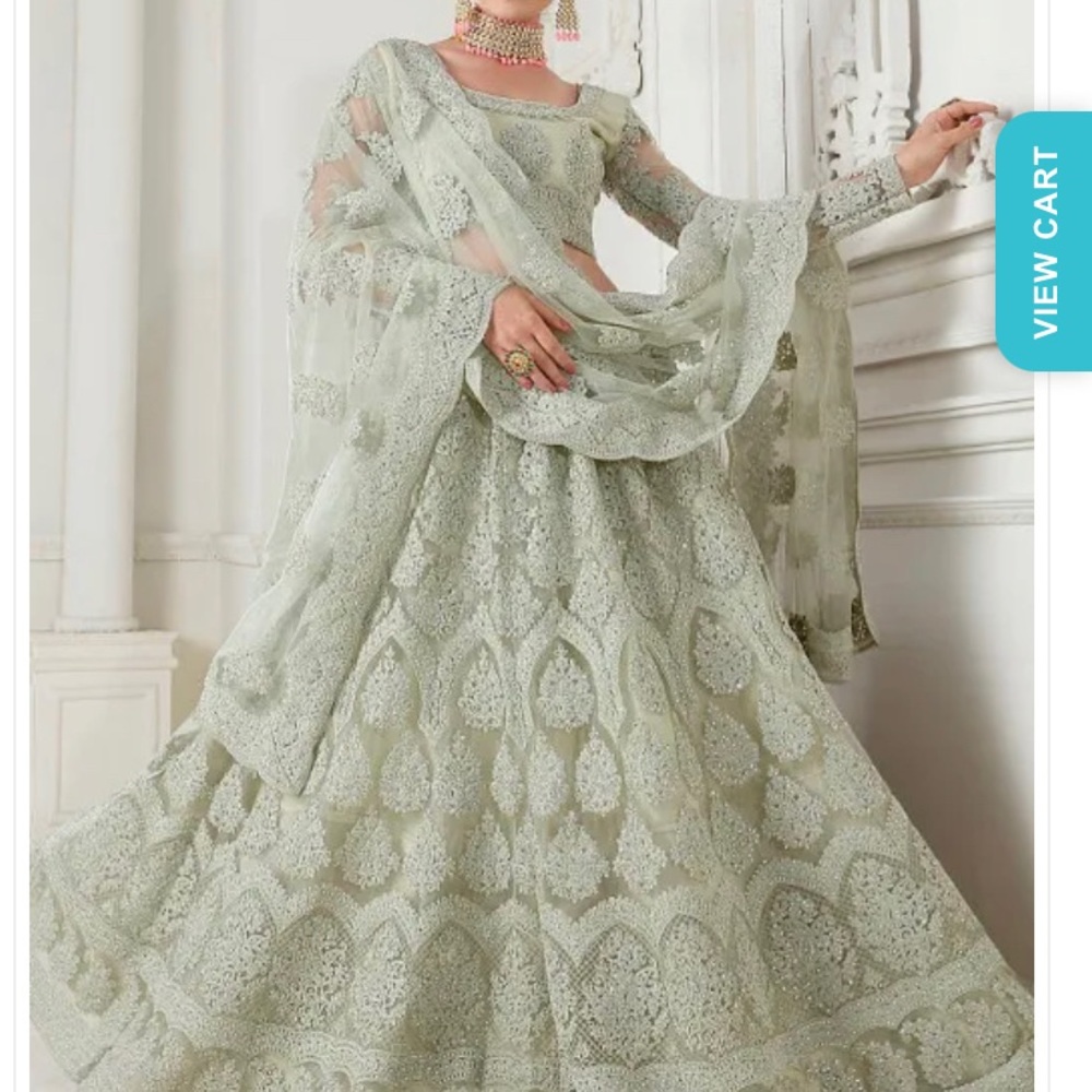 Utsav embroidered green lengha. Only worn once. Size 34 blouse.